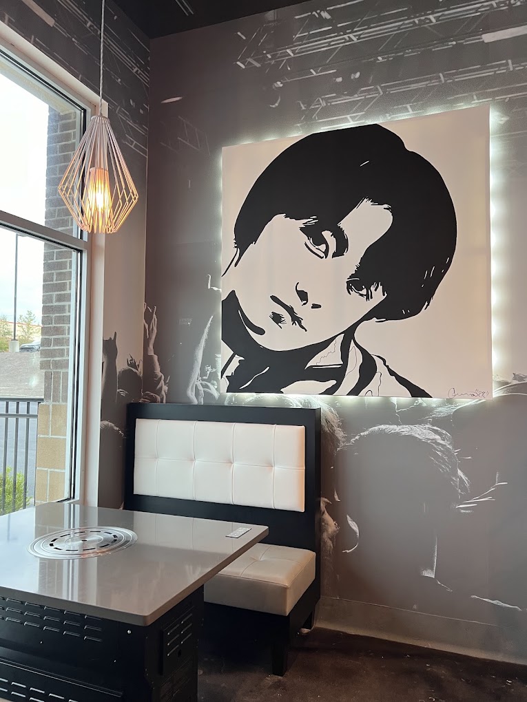 KPOP-inspired artwork lines the dining room at KPOP BBQ and Bar
