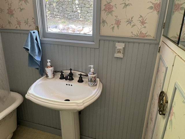 Existing pedestal sink — before remodel