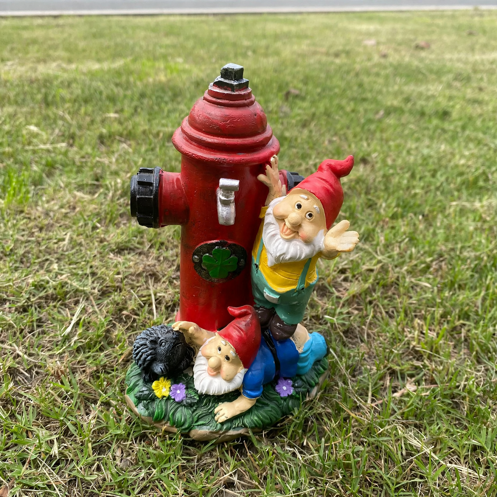 Gnome figure with red hat and fire hydrant motif