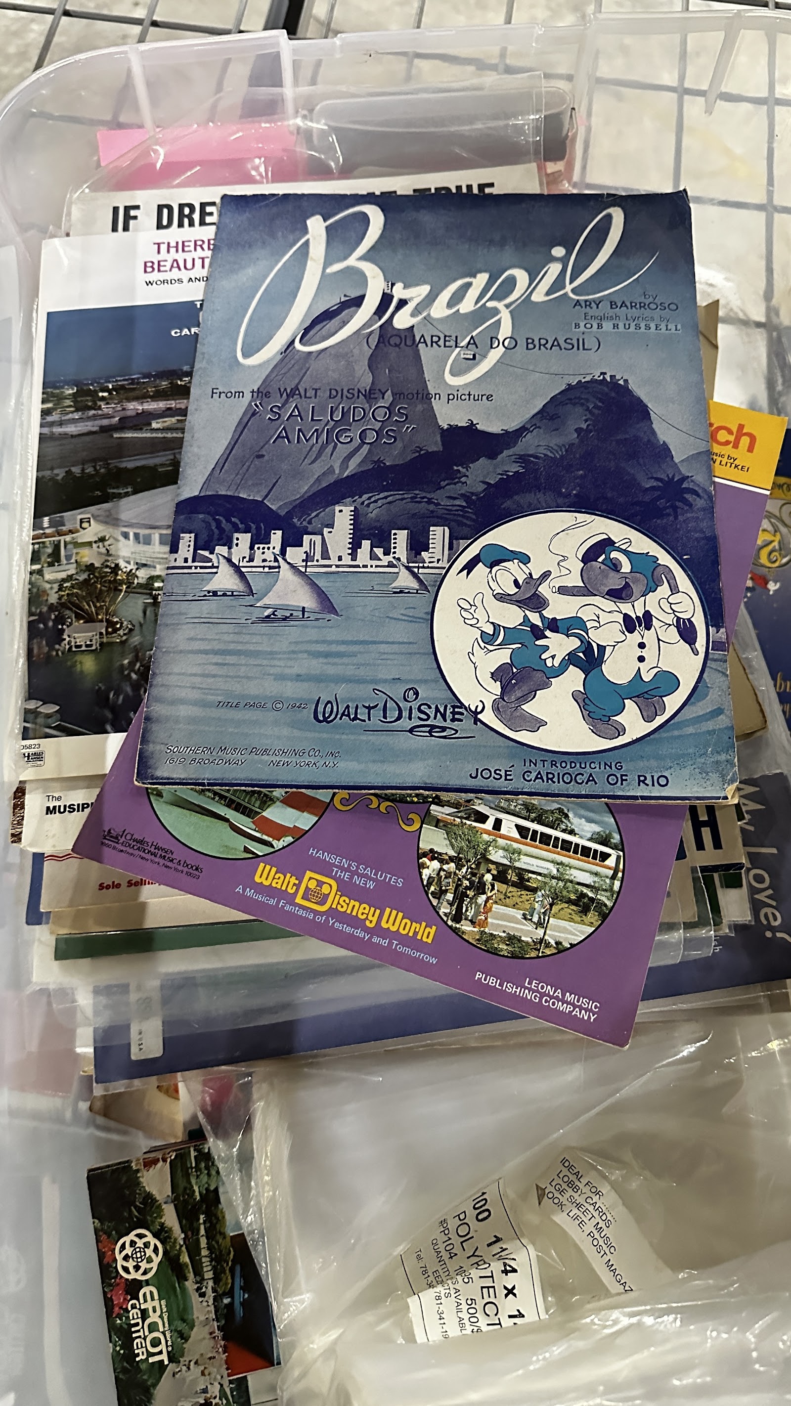 Collection of vintage Disney sheet music from the 1930s through 1970s, showing illustrated covers with Disney characters and period typography, with age toning typical of vintage paper ephemera