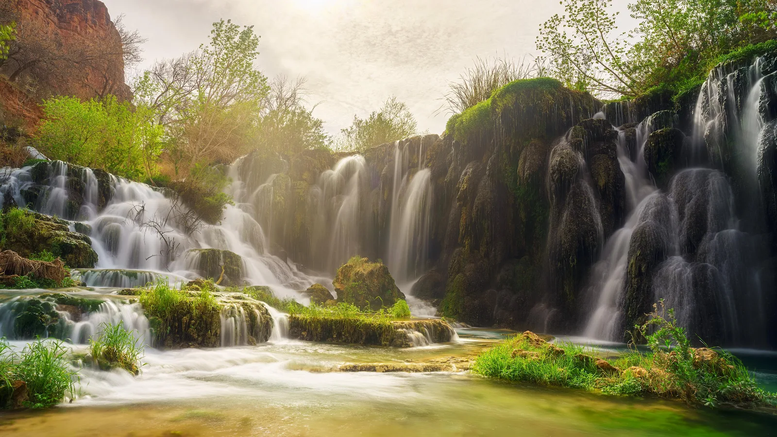 Lush Cascading Waterfalls At Sunset - Nature Photography 4K Wallpaper (3840x2160)