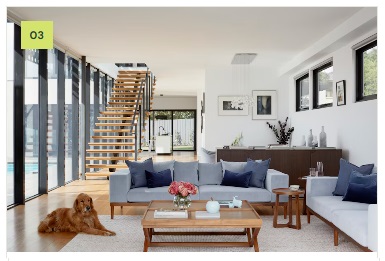Bright double-height living room with a clean ceiling finish
