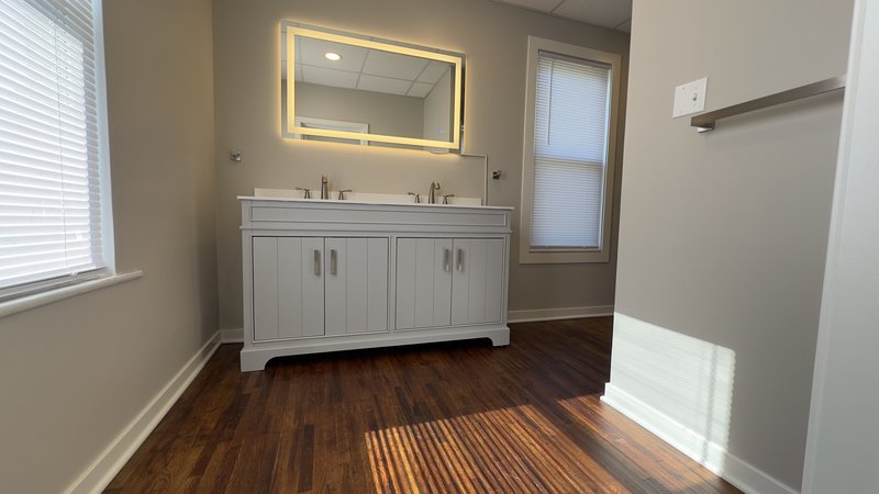 Newly installed bathroom vanity and mirror in Eureka IL home