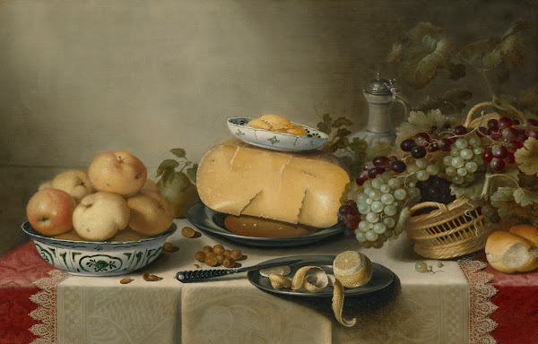 Cheese and a butter dish on a pewter plate apples in a porcelain bowl a basket o