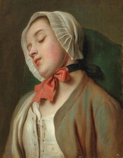 A Young Woman Sleeping In A Chair