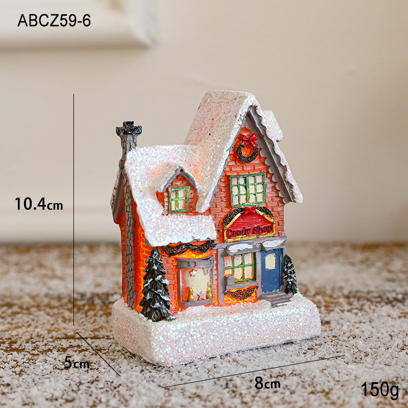 Illuminated Christmas House made of Resin for Table Decoration