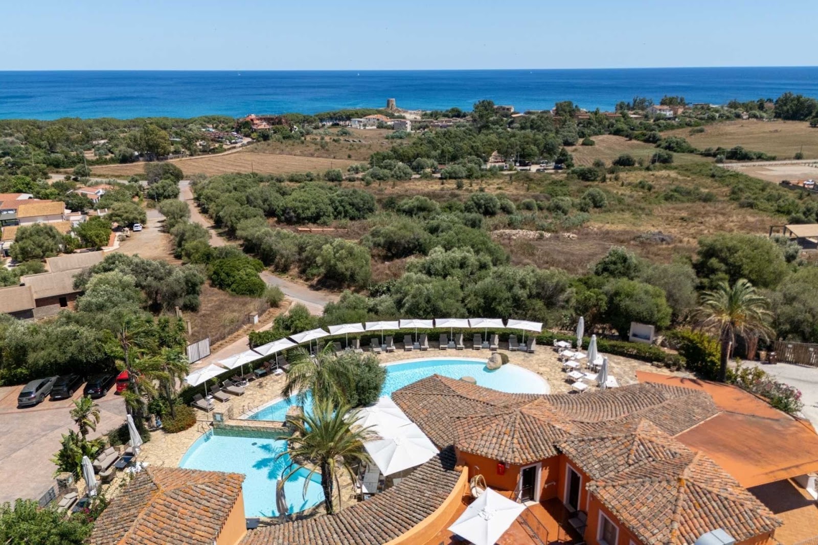 Galanias Hotel and Retreat in Bari Sardo, Sardinia, with the sea beyond