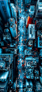 Aerial View of Neon City Streets at Night with Traffic