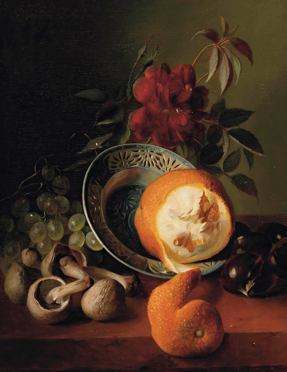 A rose grapes mushrooms an orange and chestnuts