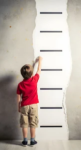 Young Boy Measuring Height Growth Chart Concrete Wall