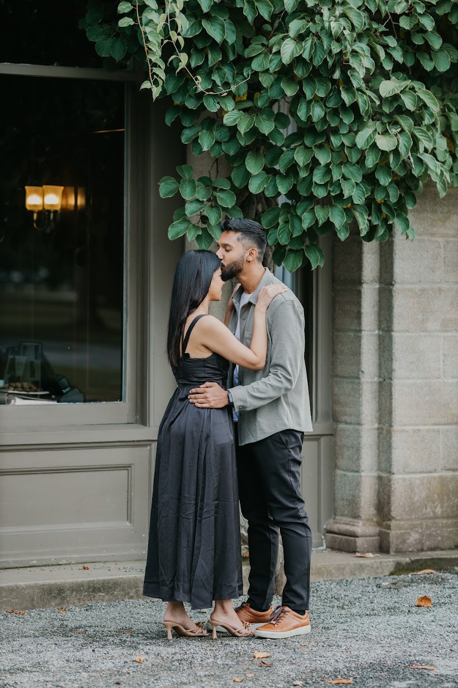 Engaged couple in a quiet candid moment outdoors