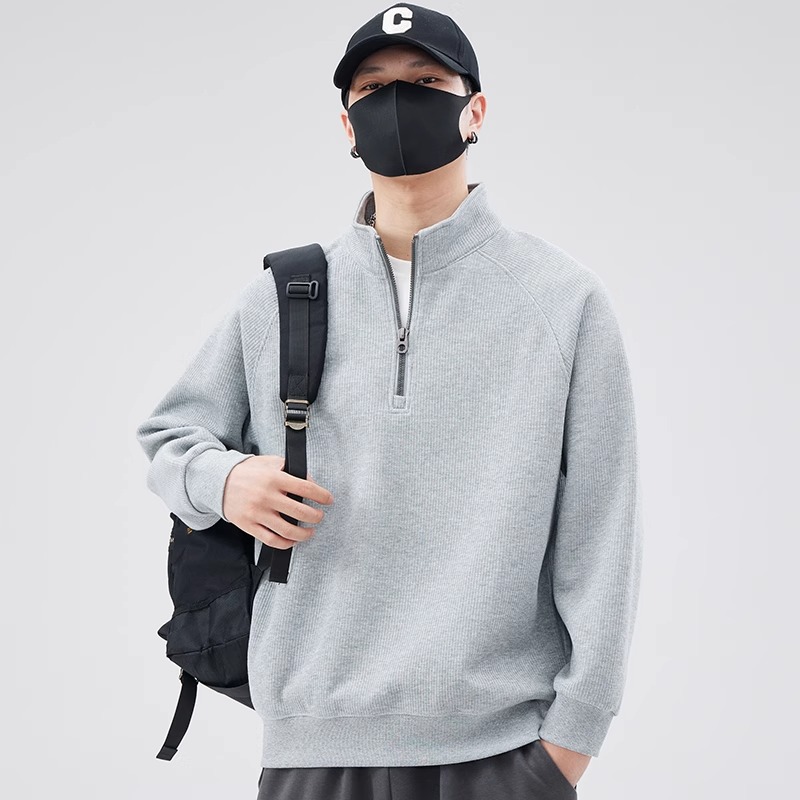Loose sweater with stand-up collar and zipper