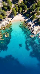 Turquoise Water Cove with Pine Trees and Boulders