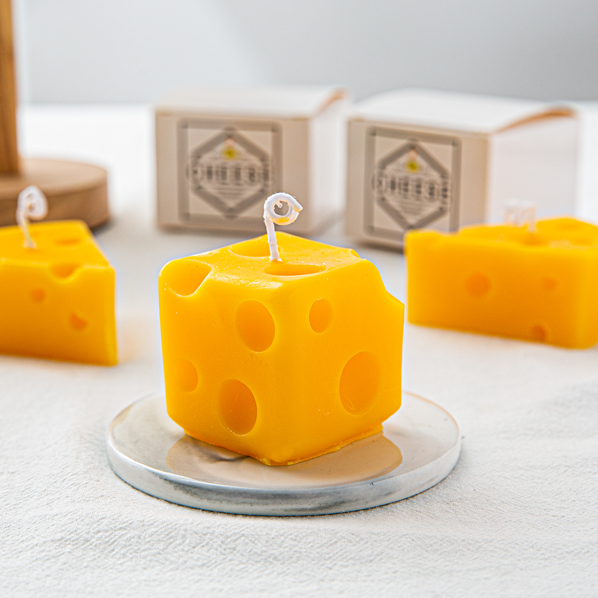 Fragrant candle in cheese shape made of soy wax