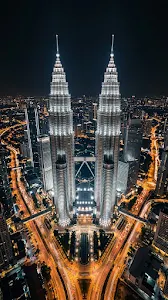 High-Angle Aerial Night View of the Petronas Twin Towers