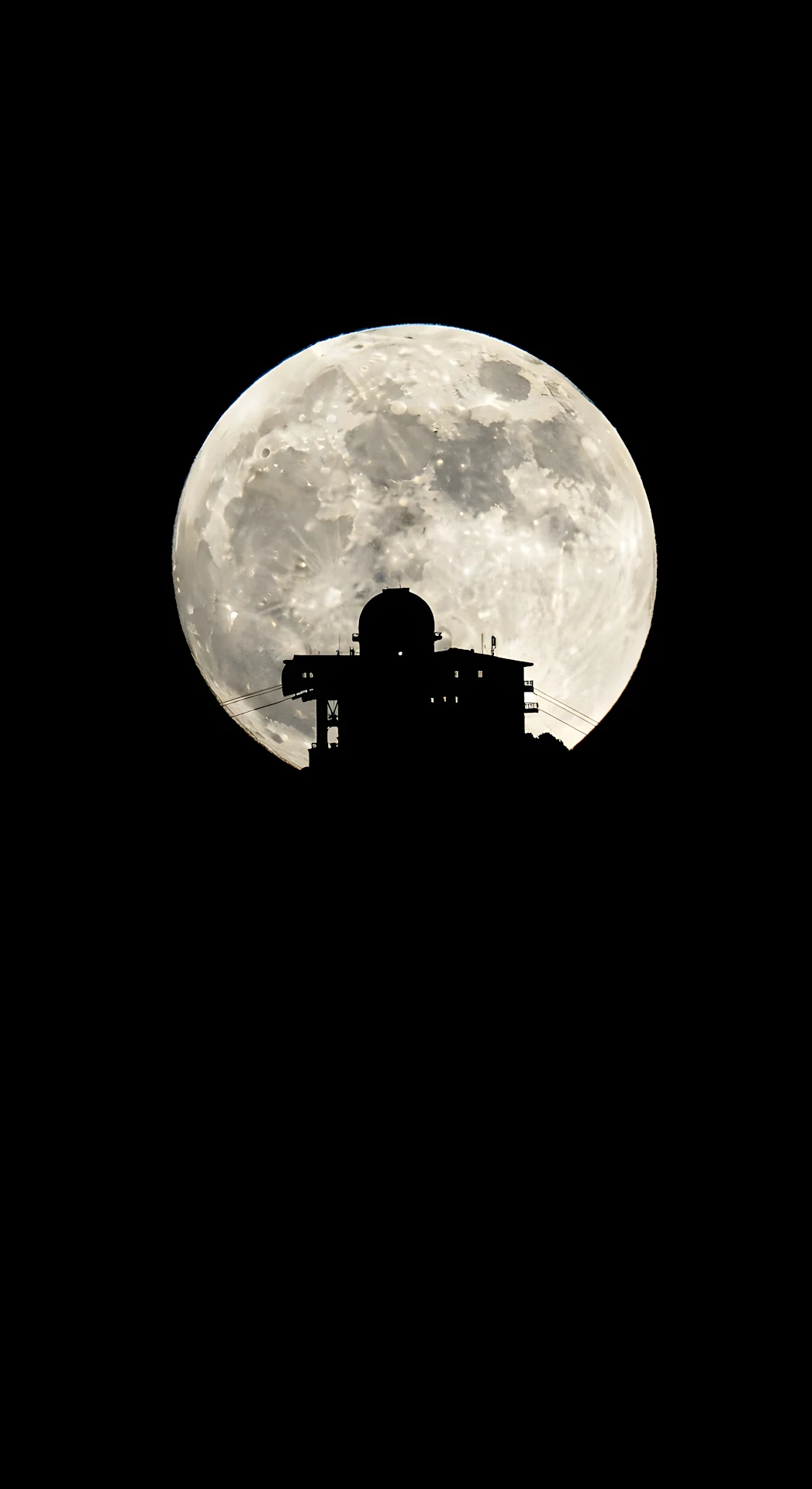 High-Contrast Silhouette of Alpine Summit Structure Against a Giant Full Moon - Free 4K mobile Wallpaper