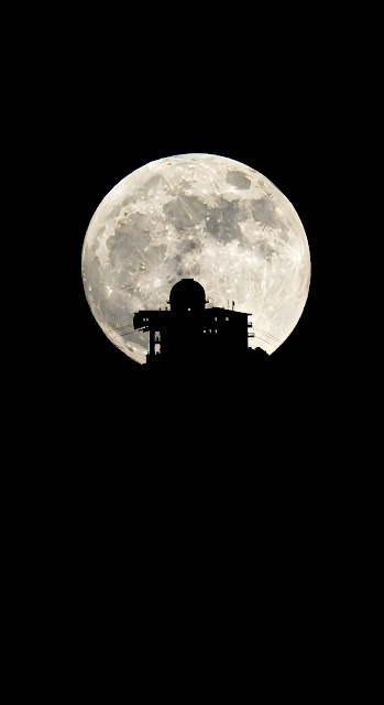 High-Contrast Silhouette of Alpine Summit Structure Against a Giant Full Moon - Free mobile Wallpaper