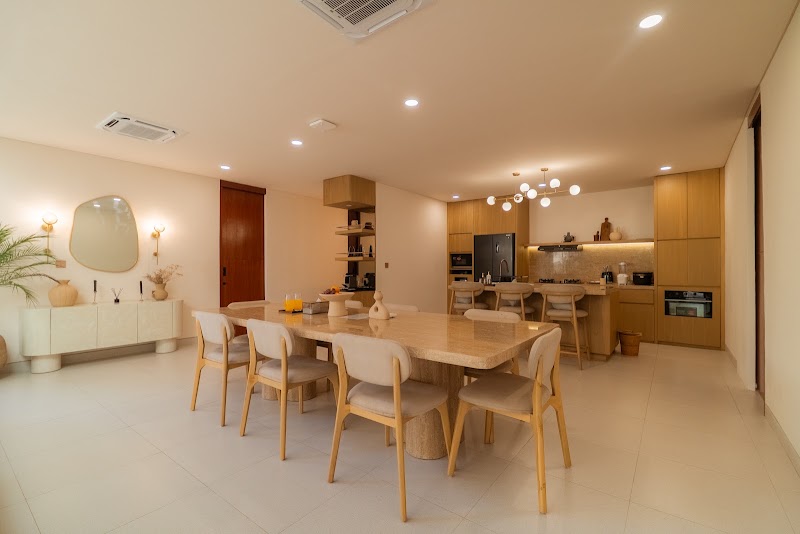 Designer kitchen and dining with rattan chairs at La Calma