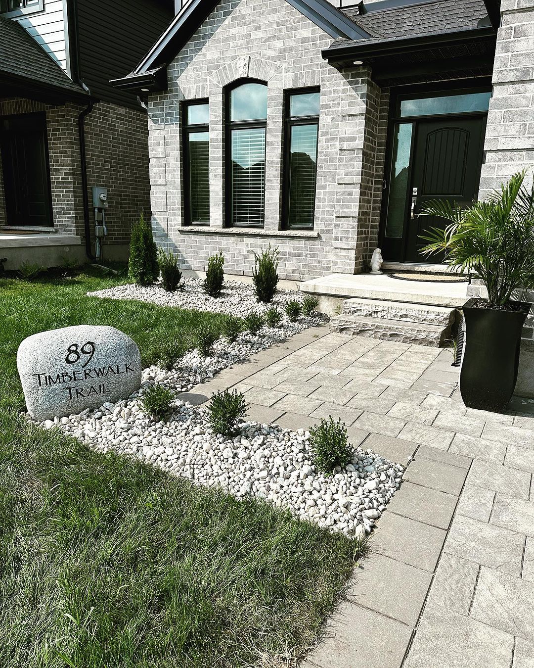 Backyard stone patio and fire pit surround in London, Ontario