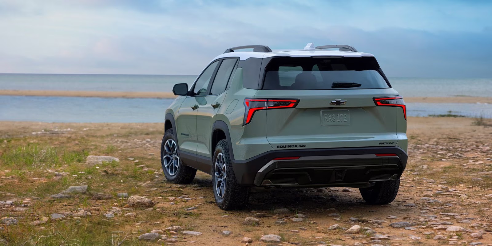 2026 Chevy Equinox ACTIV trim driving on a scenic road
