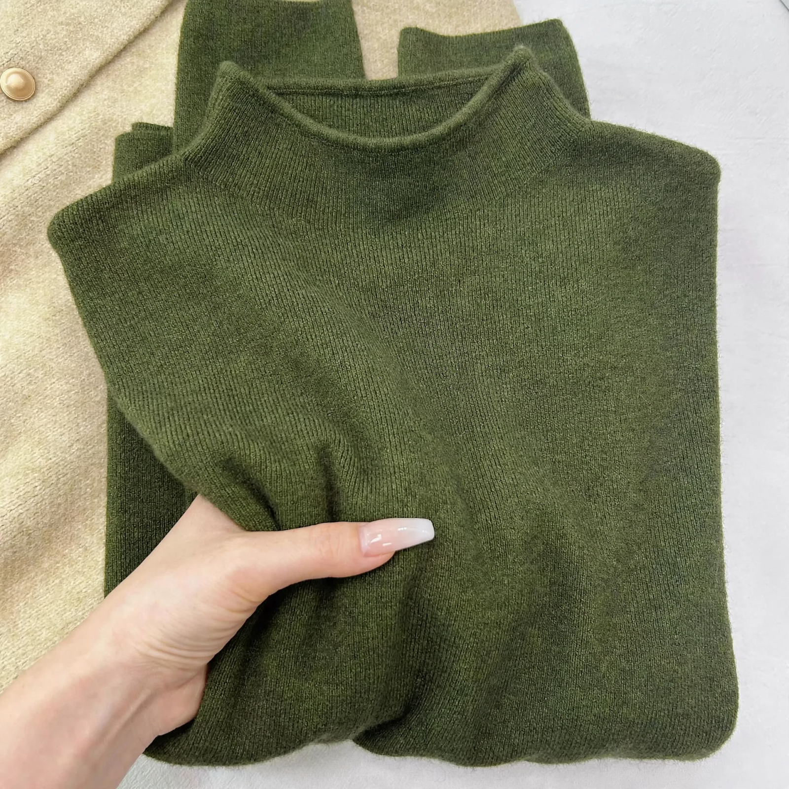 Women's knitted pullover, high collar, simple design