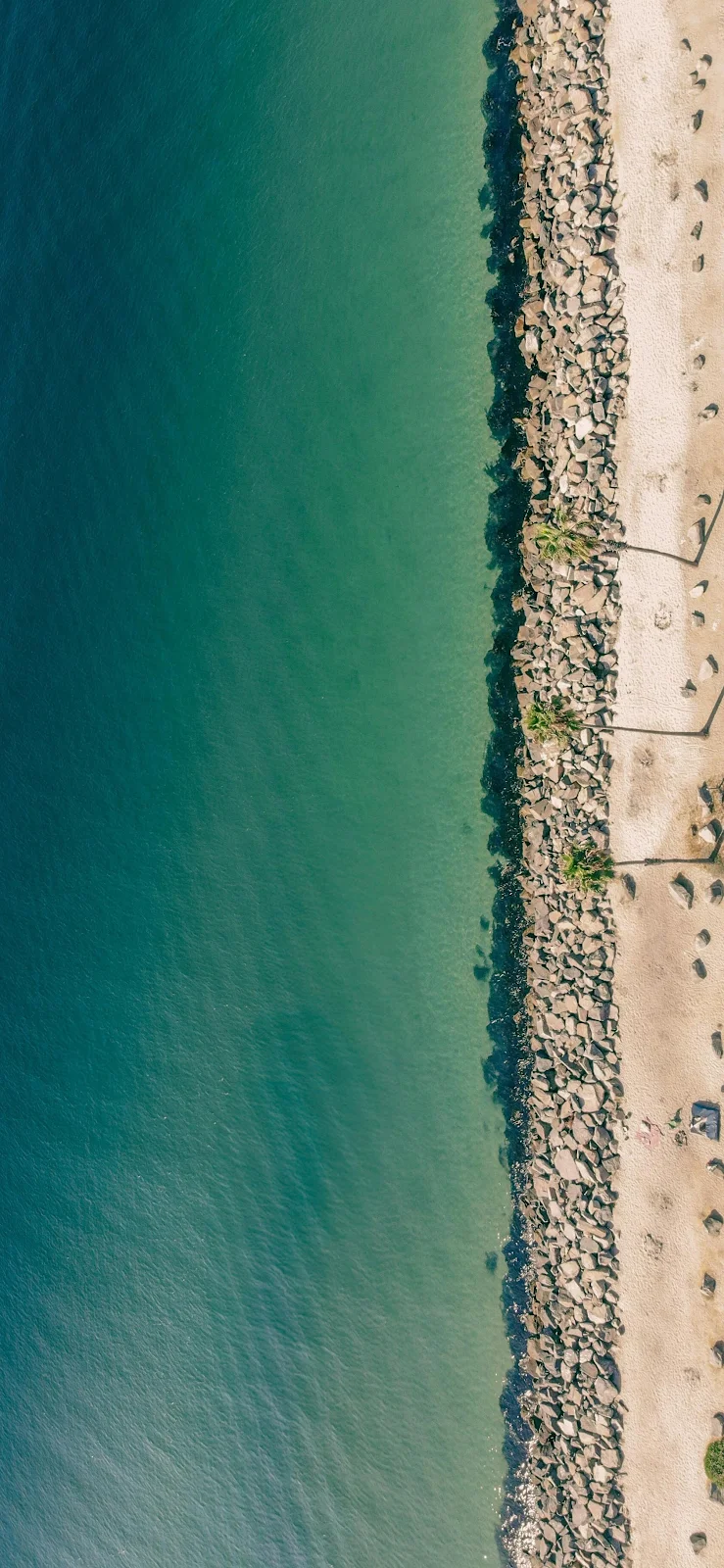 Aerial View Of Rocky Shoreline - Aerial Drone Photography 2K iPhone Wallpaper (1695x3672)