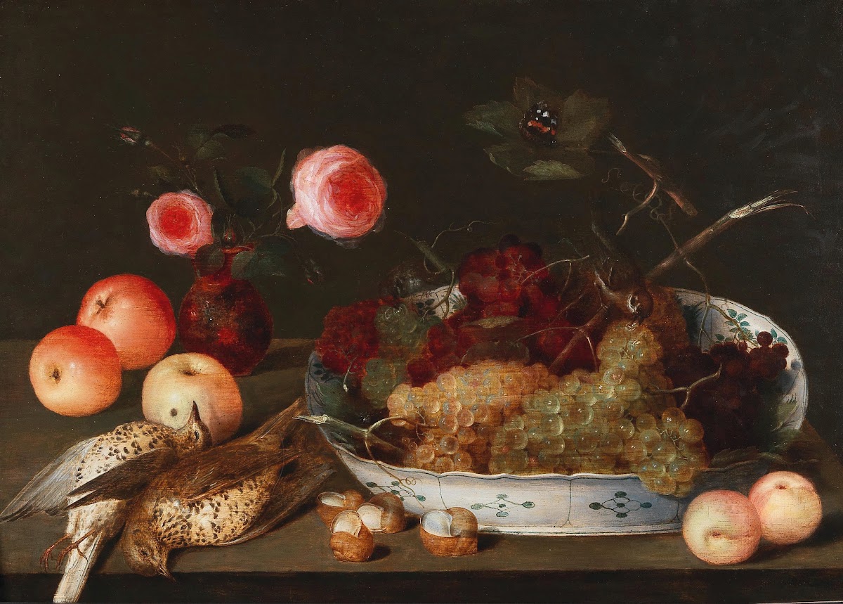A fruit and flower still life with birds