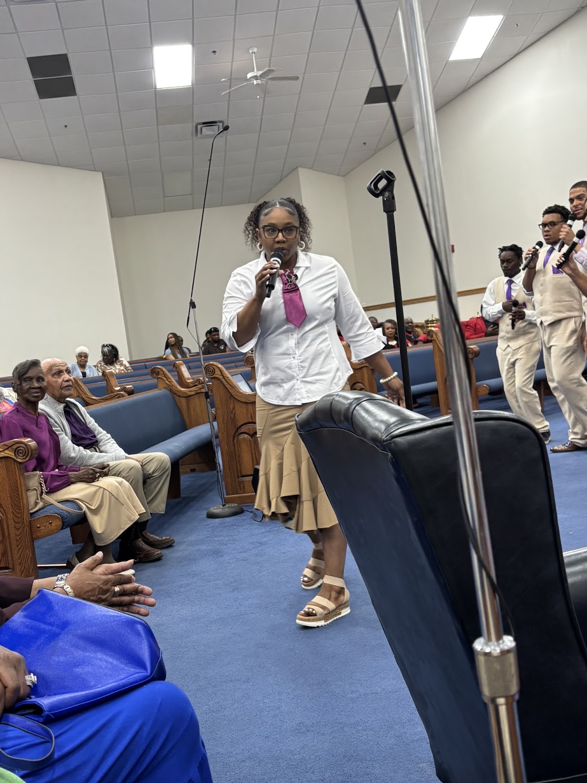 Soloist singing in the church aisle at Homecoming Revival 2026 Sharpe Road Church of Christ