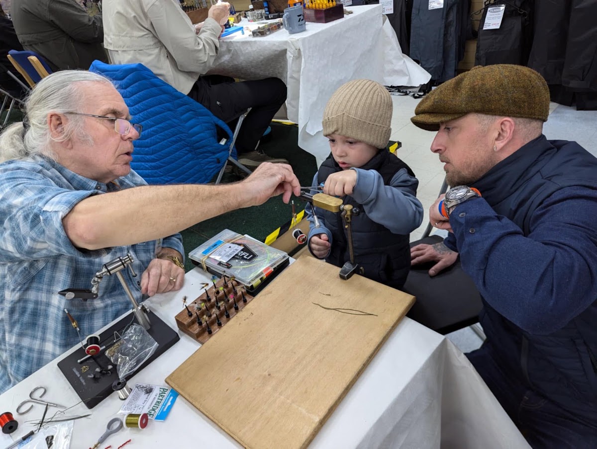 John Hood helping new fly tyers