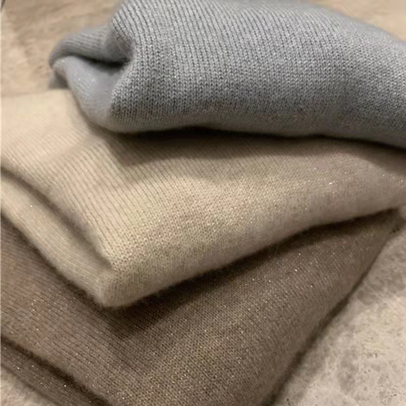 Women's wool sweater with stand-up collar and shine effect