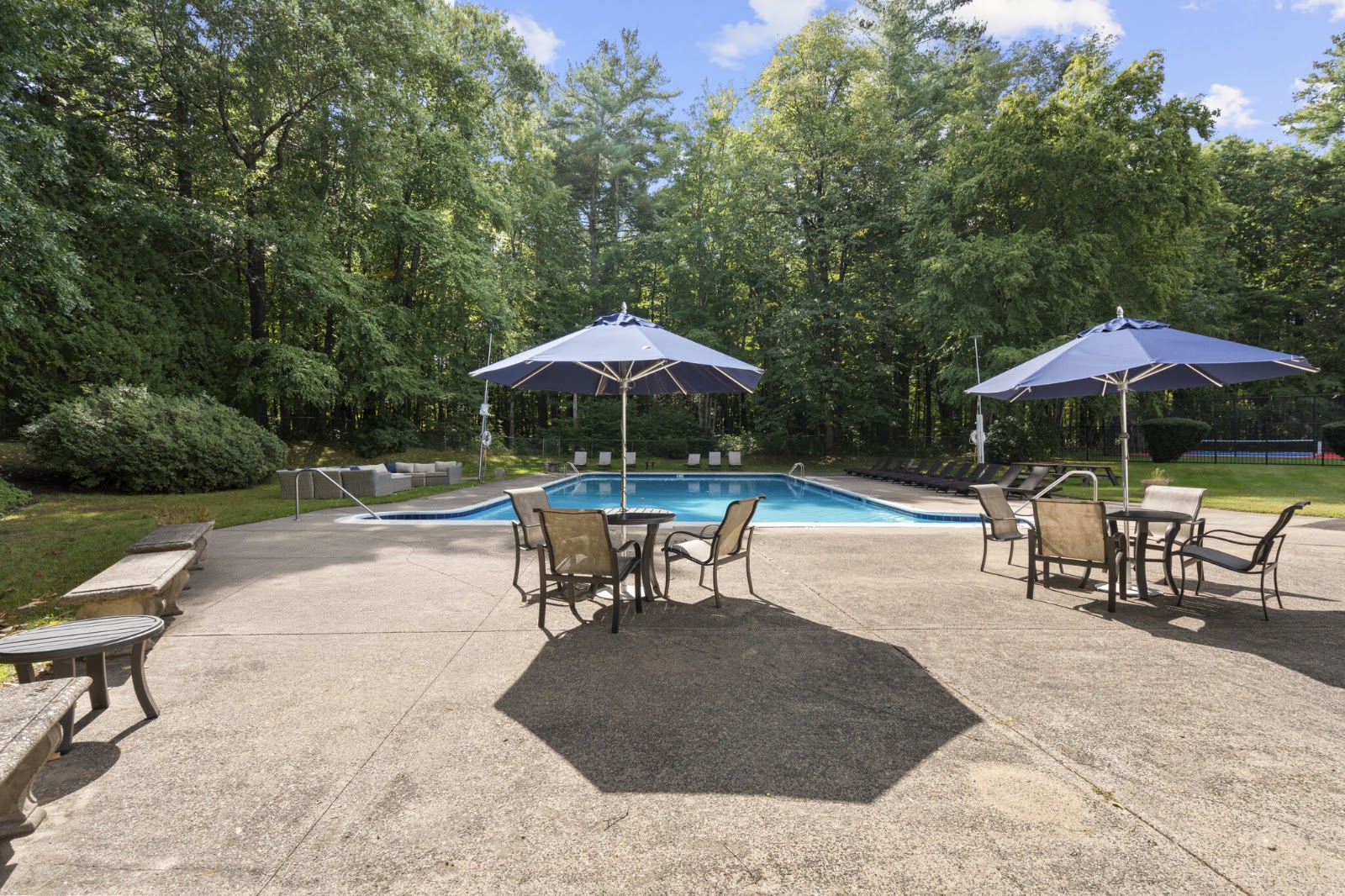 Pool deck with shaded tables