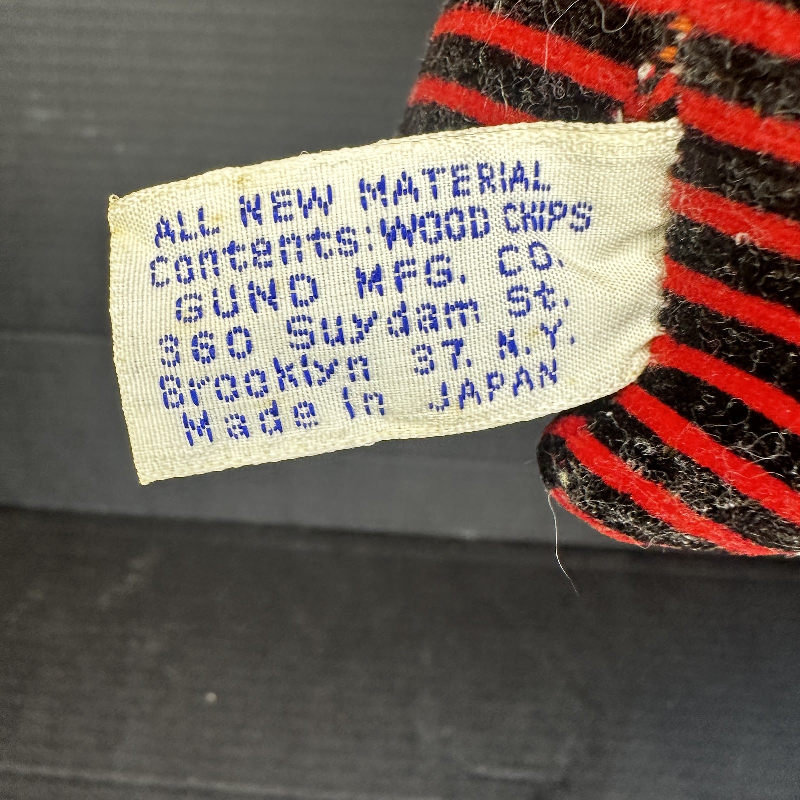 Vintage Gund ladybug plush toy with red fabric body, made in Japan circa 1950s–1960s, wood chip fill, Gund Brooklyn label