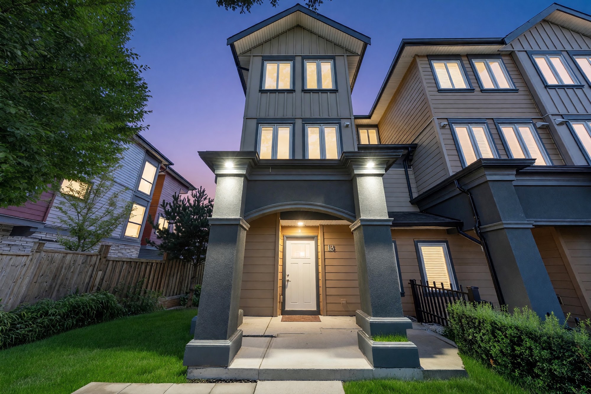 13-9800 Granville Ave, Richmond — the front door at dusk