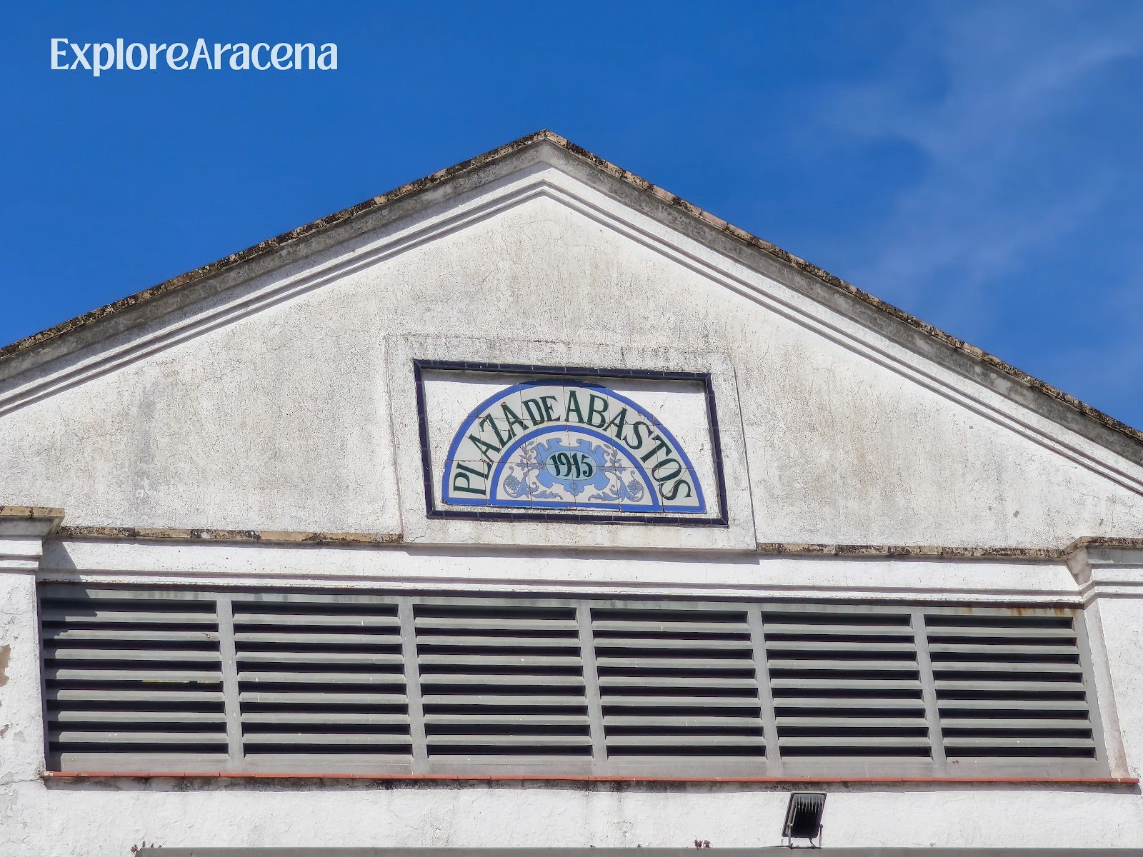 Ceramic tile sign reading 