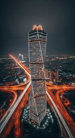 Neon Tower Above City Nightscape