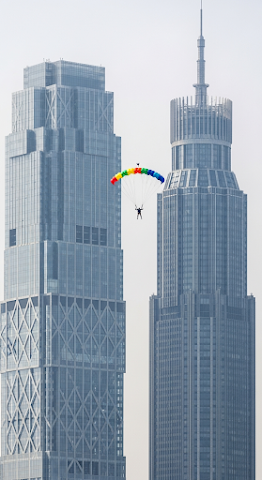 Parachuter Between Modern Skyscrapers