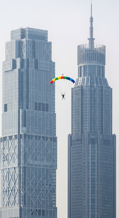 Parachuter Between Modern Skyscrapers