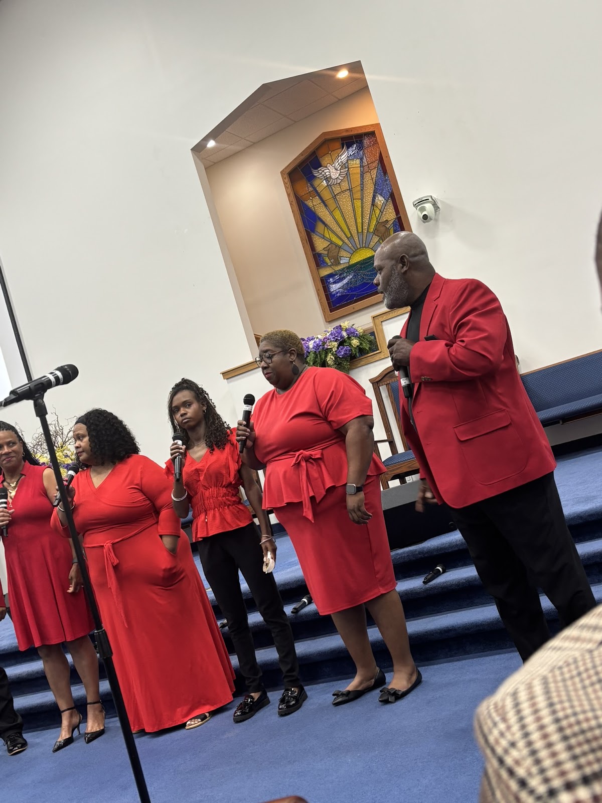 Sharpe Road Church of Christ choir in red dresses performing at the 16th Annual Homecoming Concert