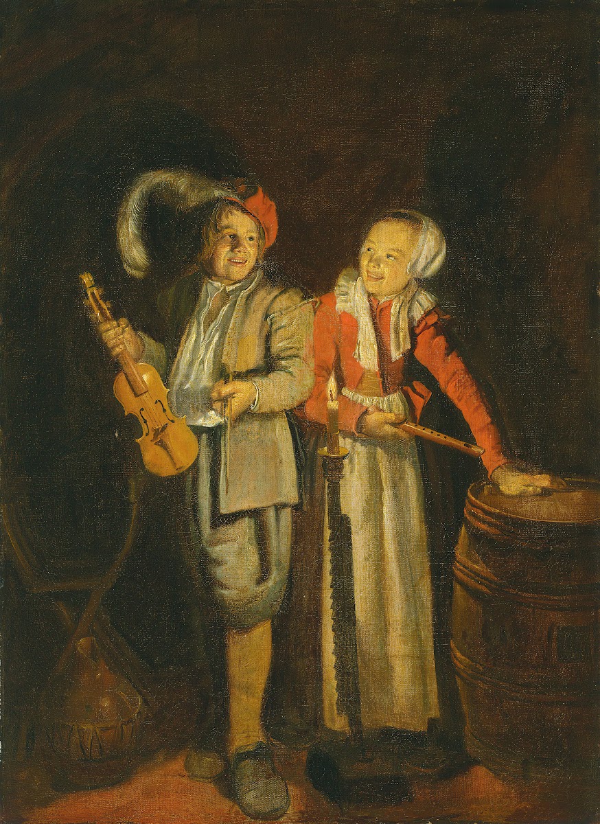 A boy and a girl playing music by candlelight