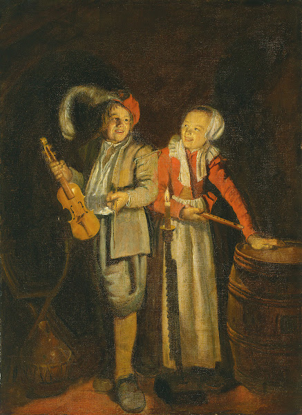 A boy and a girl playing music by candlelight