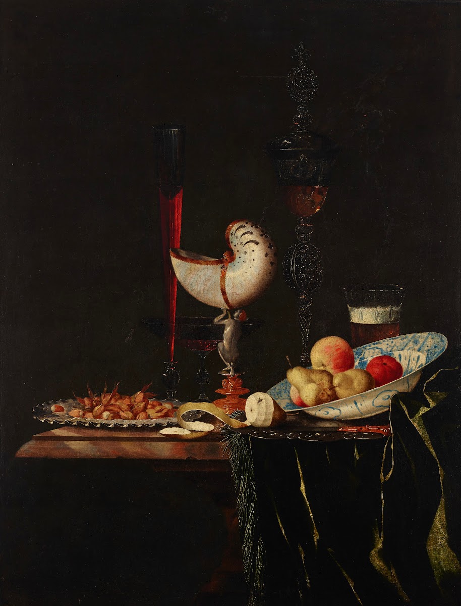 A nautilus cup a flute a façon de Venise and a wine and beer glass with nuts on
