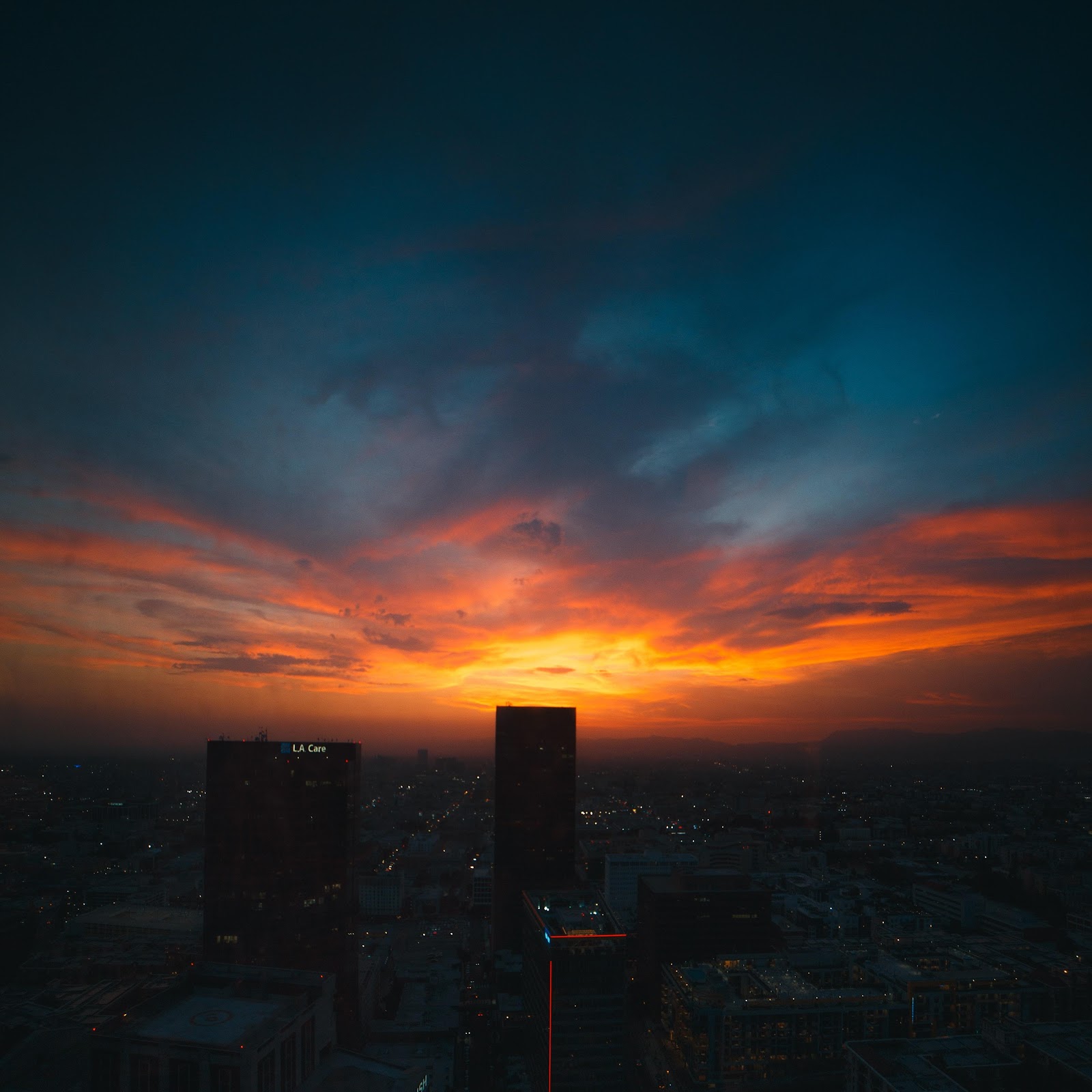 Download Sunset Over Los Angeles Skyline 5K iPhone