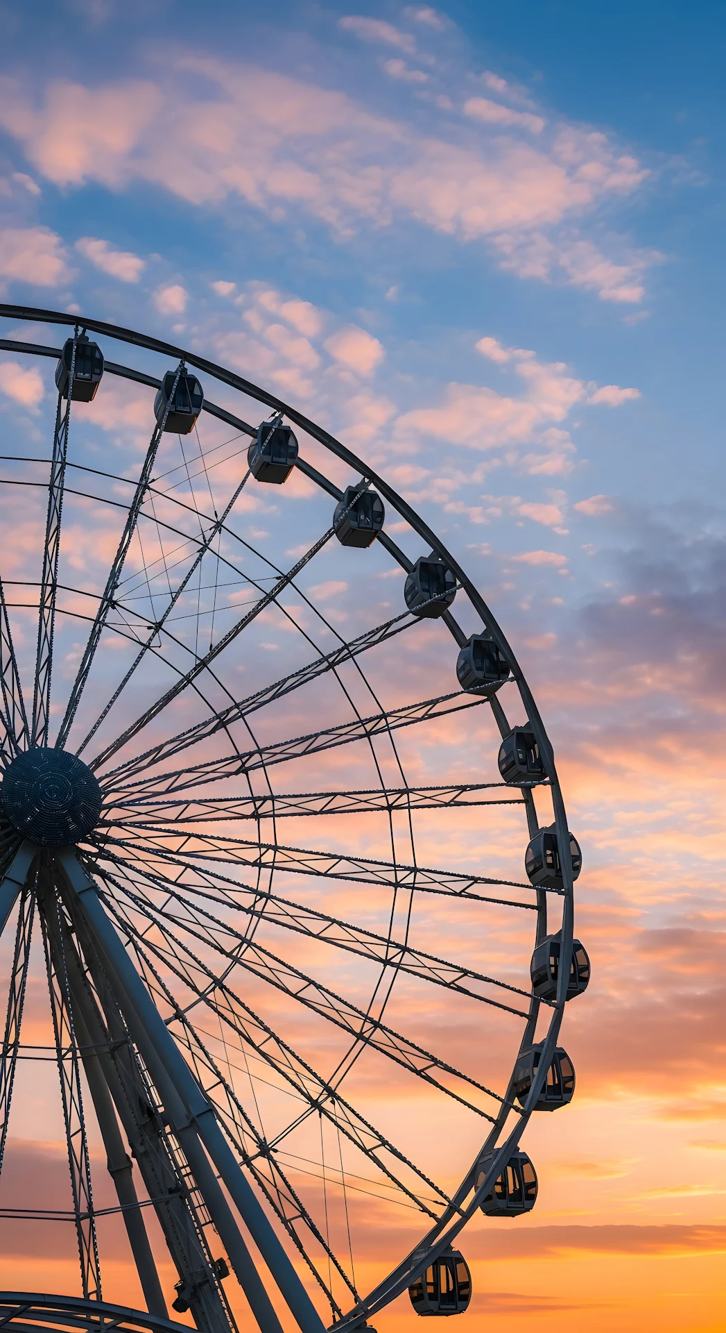 Close-up of Giant Ferris Wheel Against a Beautiful Sunset Sky with Pink and Blue Hues - Free 4K mobile Wallpaper