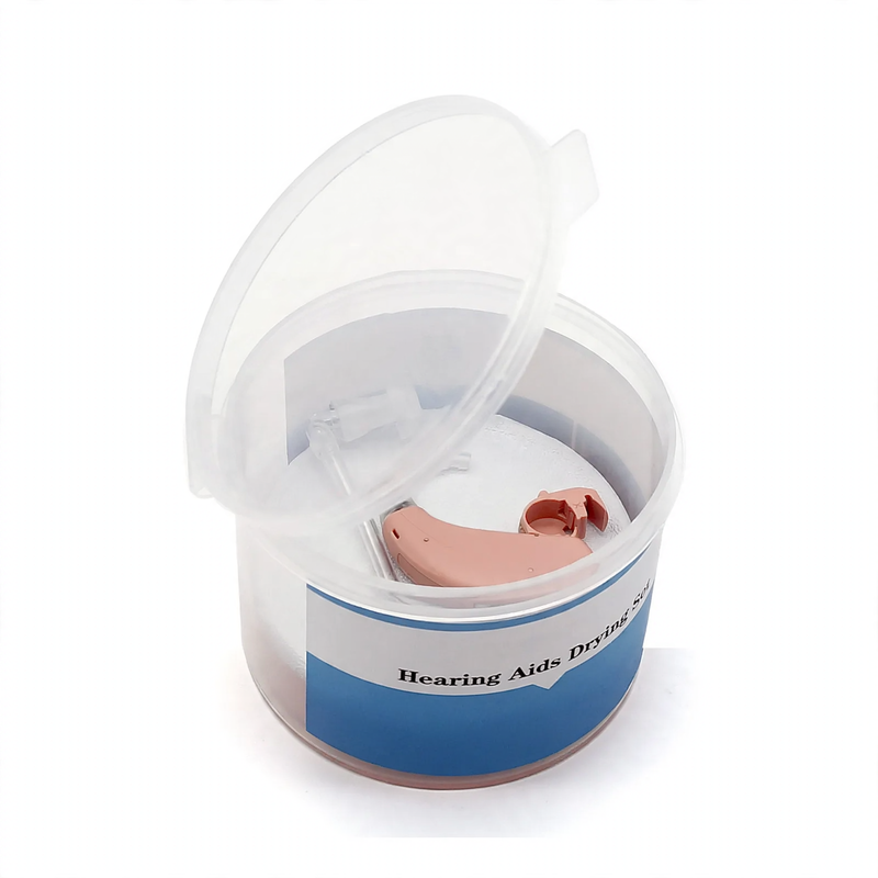 Drying box for hearing aids with drying pad