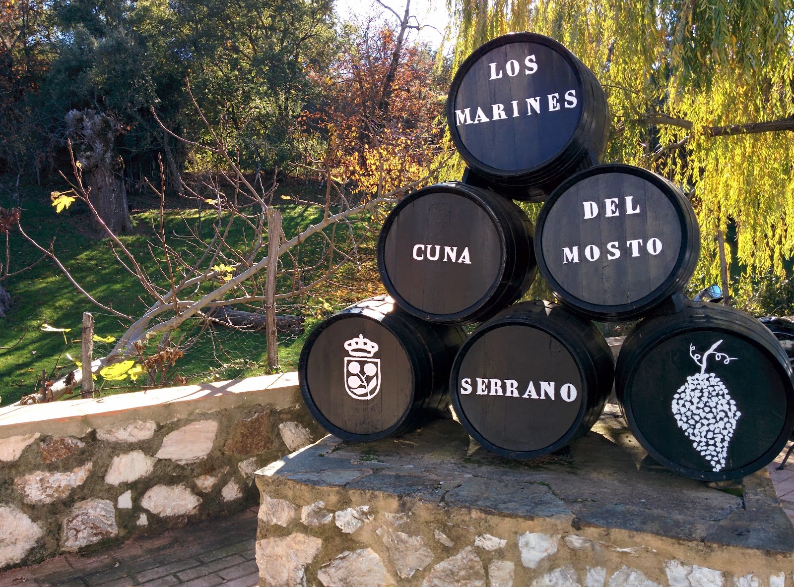 Wine barrels marked “Los Marines, cuna del mosto serrano” at the Feria del Mosto.