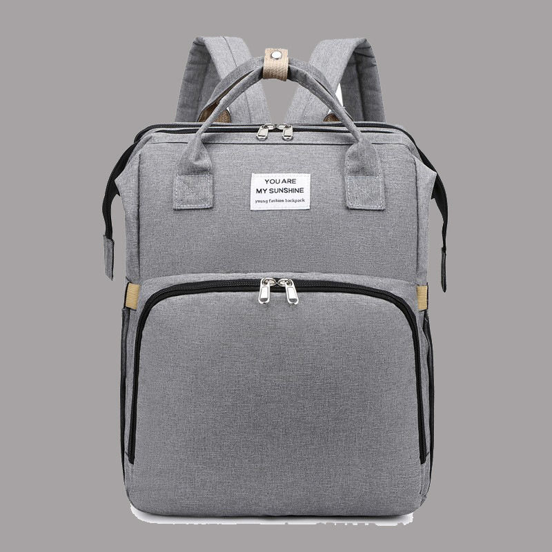 Diaper backpack with integrated changing pad