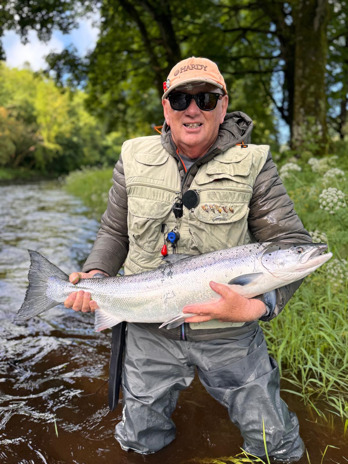 Dougie Inglis with a Salmon caught on a Sunburst Cascade fly on the Knockdolian Beat, River Stinchar