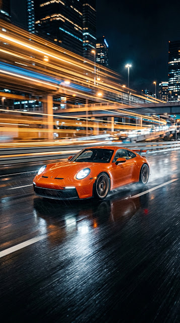 Action Sportscar Speeding Through City Streets at Night with Motion Blur - Free mobile Wallpaper
