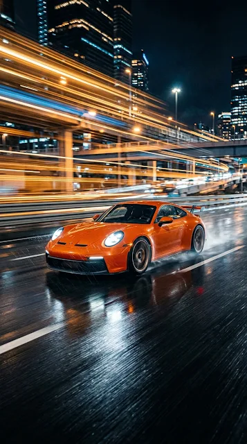 Action Sportscar Speeding Through City Streets at Night with Motion Blur
