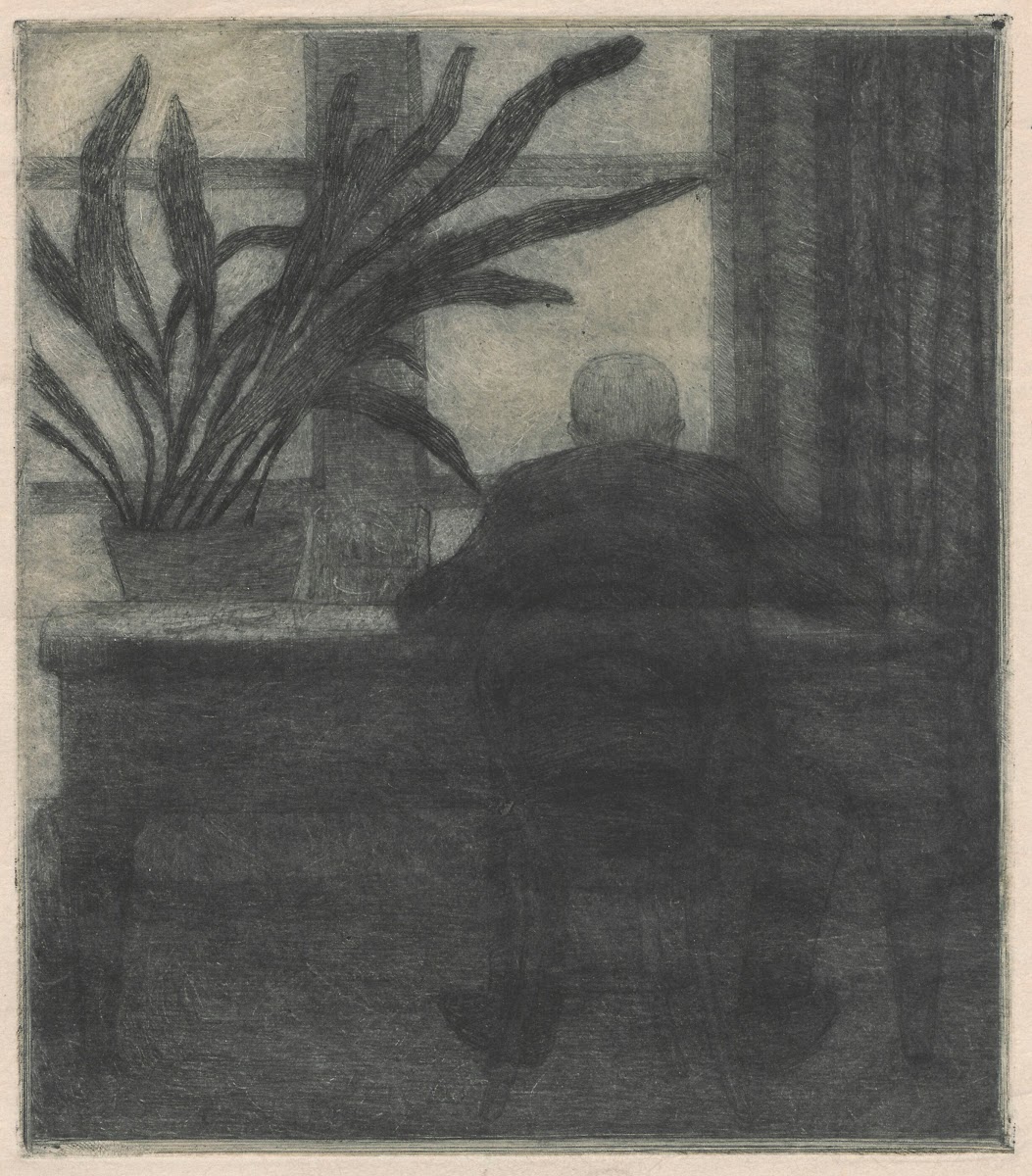 Man sitting at a desk 1909